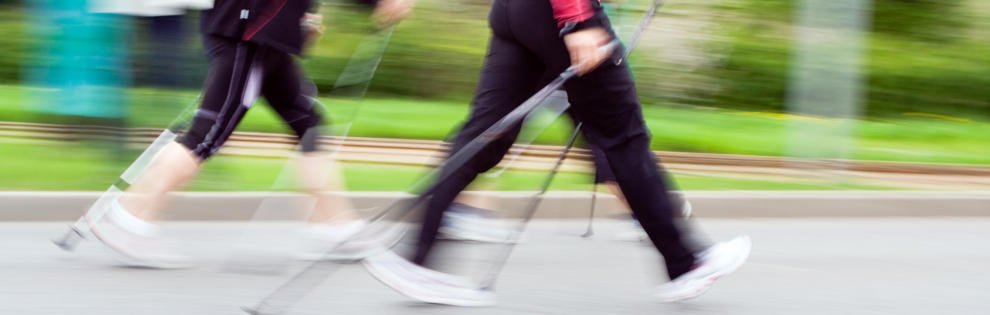Womans walking on Nordic walking race in city